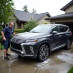 Professional mobile car wash service at a client's driveway