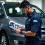 Ford technician diagnosing a car using a digital tablet