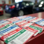 Toyota service coupons stack on top of a dealership service counter