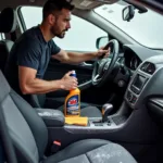 3M Car Care Products Interior Cleaning: A technician meticulously cleaning the interior of a car using 3M products.