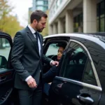 Black Car Service Chauffeur Opening Door for Passenger