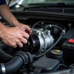 Mechanic Repairing a Car AC Compressor