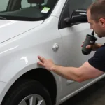 Car Body Repair: Dent Removal Process on a Damaged Fender