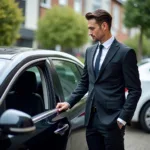 Chauffeur Opening Car Door for Passenger