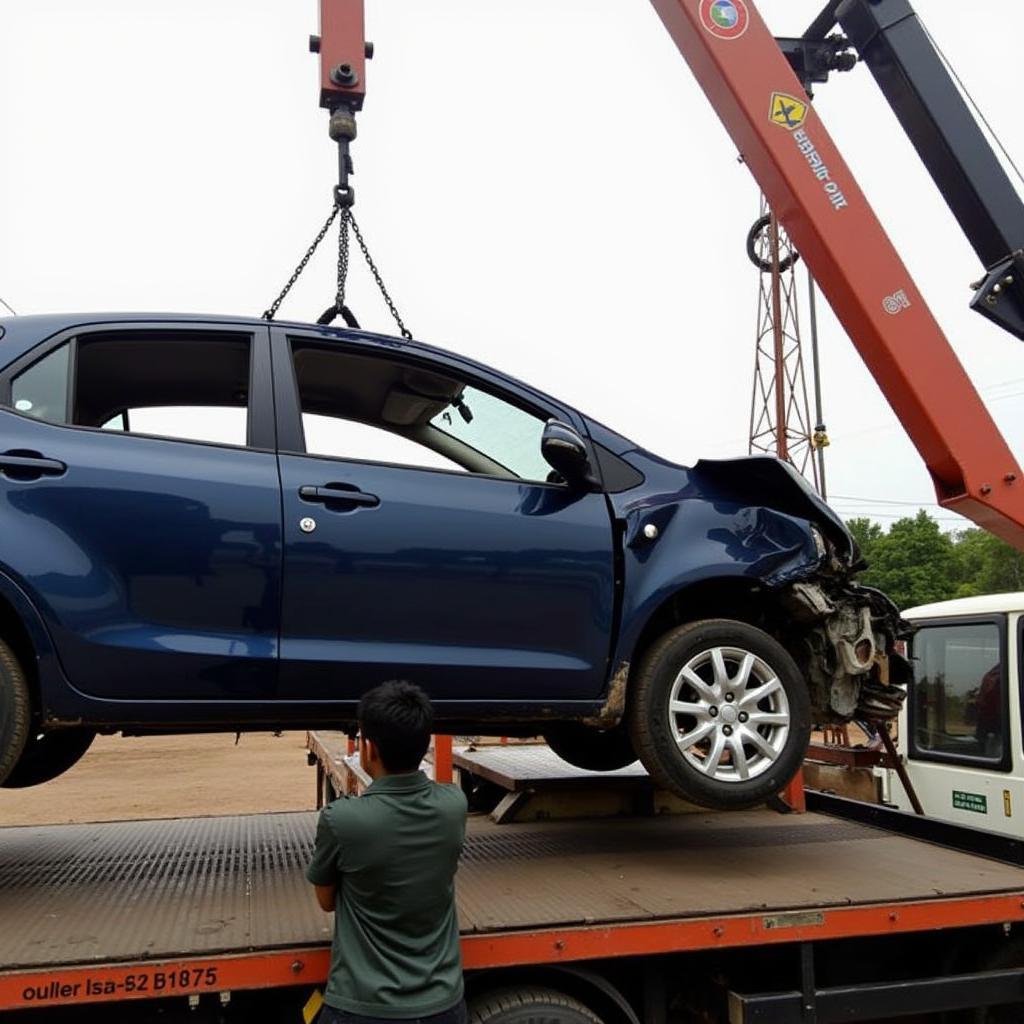 Damaged Car Being Loaded onto a Car Crane in Gurgaon