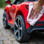 Cleaning the tires of a children's ride-on car