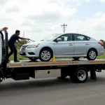 Flatbed tow truck in Tambaram picking up a car