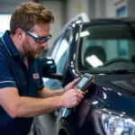 Glastonbury Car AC Service Technician Checking Refrigerant Levels