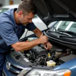 Inspecting the engine of a 13-year-old Honda City