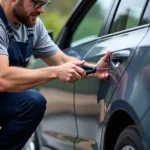 Locksmith Opening Car Door With Specialized Tools