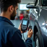 Mechanic using OBD-II scanner to diagnose a car in Chennai