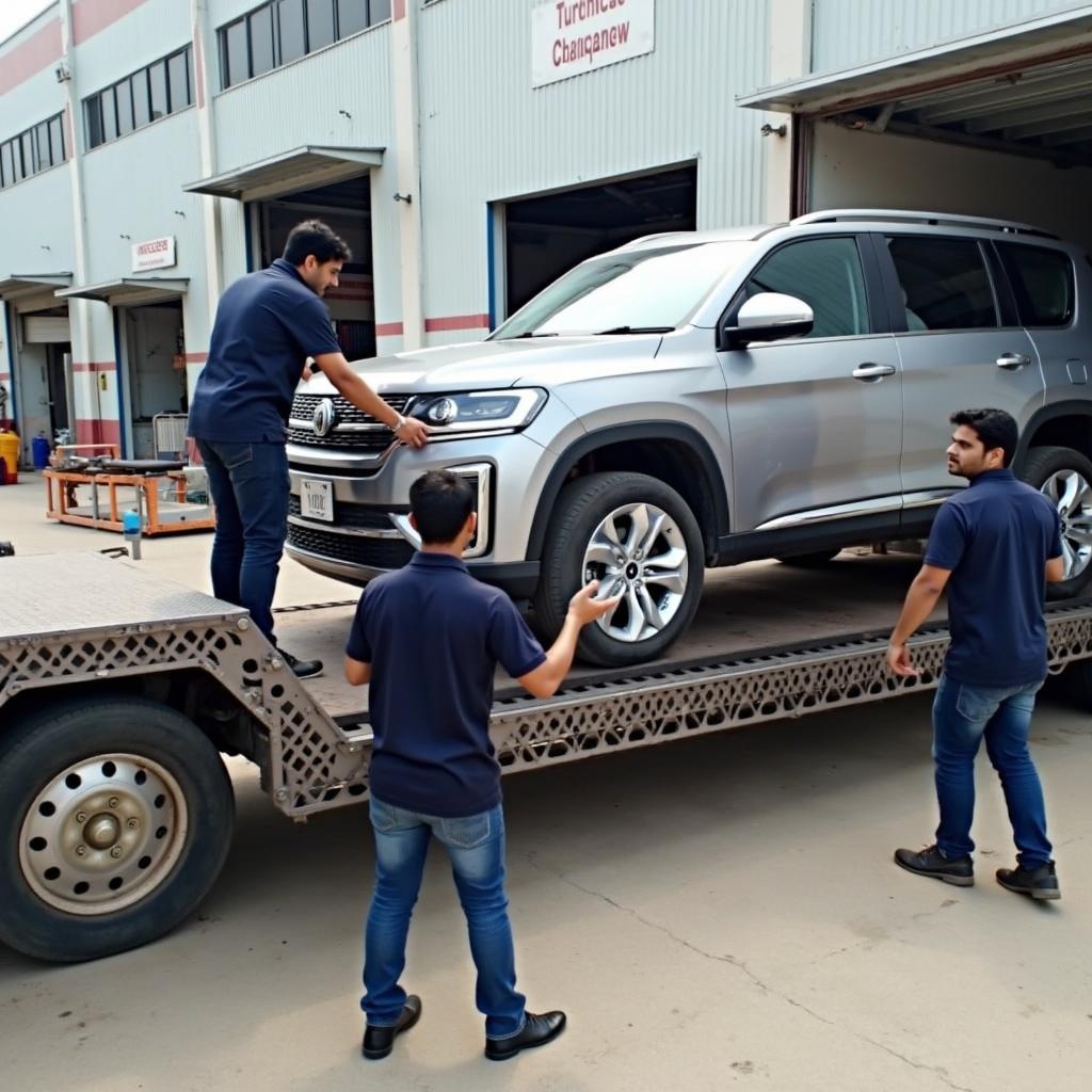 Professional car carrier in Hyderabad loading a vehicle.