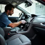 Professional car detailer meticulously cleaning the interior of a vehicle