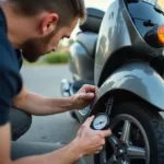 Scooter Owner Checking Tire Pressure at Home