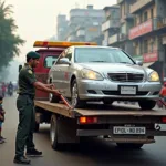 Tow Truck Driver Securing a Vehicle in Mumbai for Transport